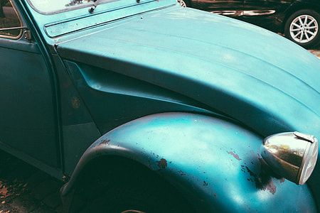 Part of an old blue car close up thumbnail