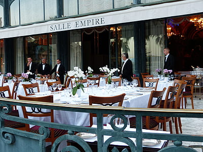 five men standing near tables thumbnail