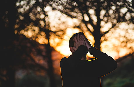 silhouette of man covering his face thumbnail