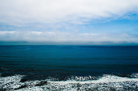 ocean under white clouds thumbnail