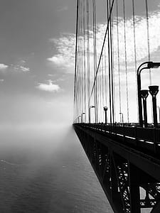 grayscale photo of suspension bridge thumbnail