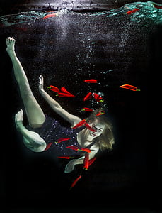 woman under body of water with chili pepper thumbnail