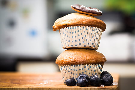 two cup cakes on table thumbnail