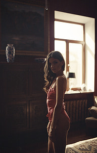 woman wearing pink one-piece bikini photo thumbnail