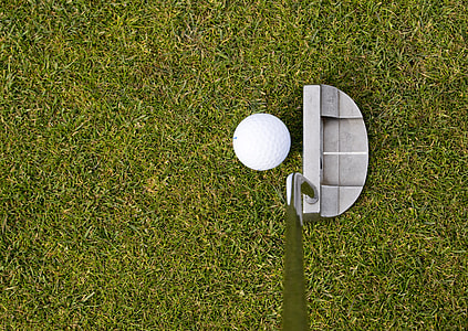 golf ball and golf club on lawn grass thumbnail
