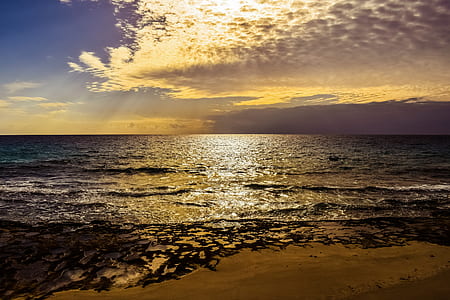photo of beach during cloudy sunset thumbnail