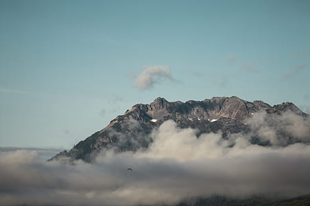 brown mountain covering with clouds thumbnail