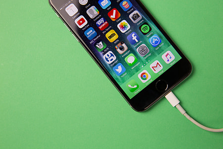 Apple iPhone mobile smartphone on charge thumbnail