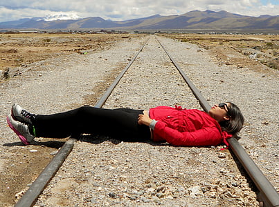 woman laying on train rail thumbnail