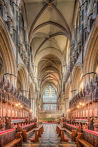 brown wooden bench inside church thumbnail