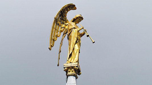 angel playing flute statue at daytime thumbnail