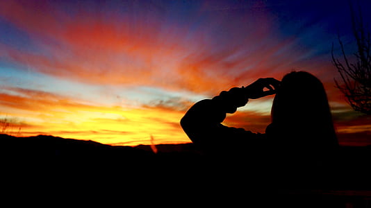 silhouette photography of a woman during golden hour thumbnail