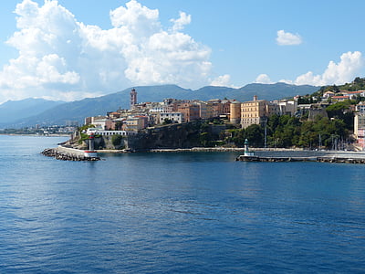 buildings beside body of water thumbnail