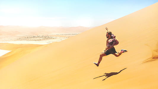 man jump over the landscape field with shadow thumbnail