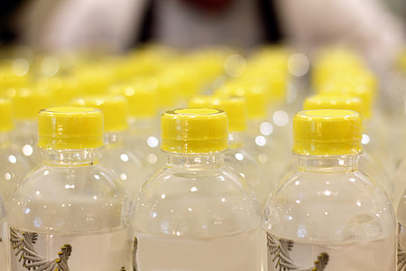 clear plastic bottle with yellow cap lot thumbnail