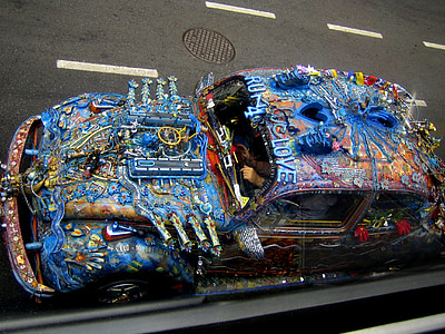 blue and brown Volkswagen Beetle on road thumbnail