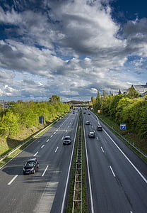 time lapse photography of vehicles on road thumbnail
