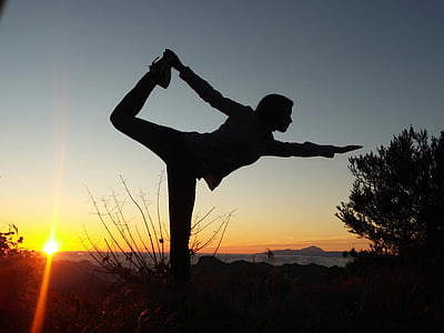 silhouette photo of person doing yoga position thumbnail