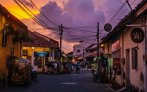 white houses under cloudy sky thumbnail