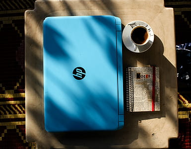 Top View Photo of Laptop Near Coffee Cup thumbnail