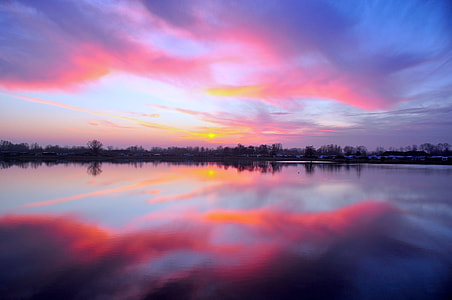 body of water during sunset thumbnail