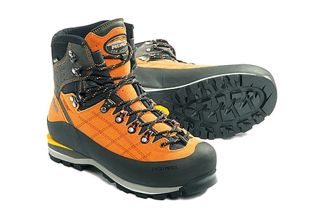 pair of orange hiking boots against white background thumbnail