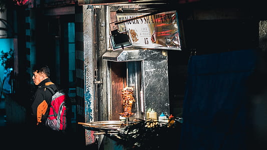 man standing near gyro machine thumbnail