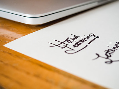 white printer paper beside laptop thumbnail