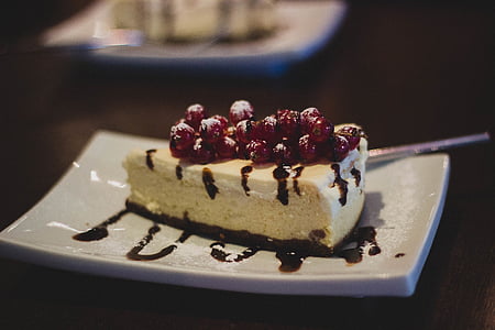 shallow focus photography of cheesecake slice served on plate thumbnail