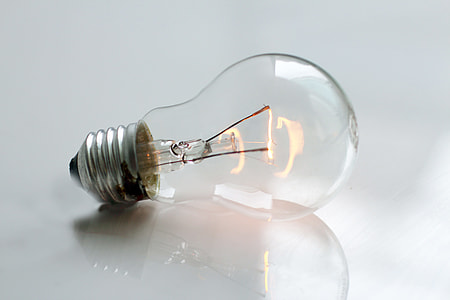 clear light bulb on top white surface thumbnail