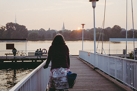 Girl on bike watching the sunset thumbnail