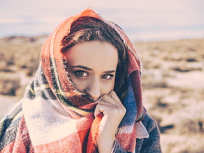 woman wearing white, black, and red plaid scarf during daytime thumbnail