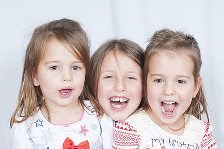 three children wearing white shirts thumbnail
