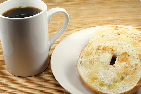 bread sliced on saucer beside cup of coffee thumbnail