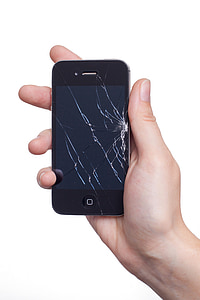 person holding cracked black iPhone 4 thumbnail