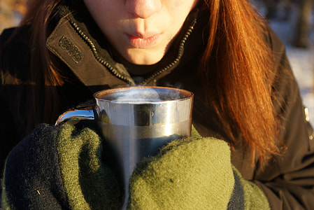 woman blowing gray hot stainless steel cup thumbnail