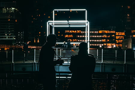 silhouette of two person overlooking at bridge thumbnail