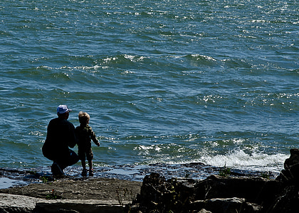 person sitting on seashore thumbnail