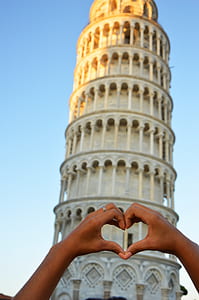 person doing heart hand sign near Leaning Tower of Pisa thumbnail