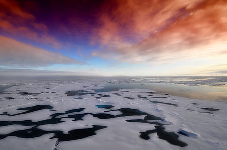 cloudy sky over frozen lake thumbnail