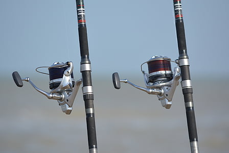 two silver fishing reels thumbnail