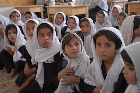 group of people wearing white hijab headdress thumbnail