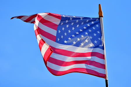 USA flag under blue sky thumbnail