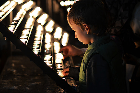 kid in front of candles thumbnail