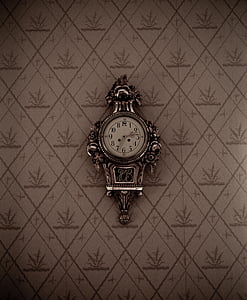 silver-colored analog clock with floral background thumbnail