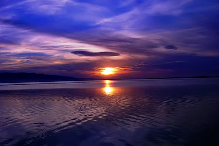 sunlight reflection of calm water at golden hour thumbnail