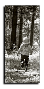 child wearing hat near trees thumbnail