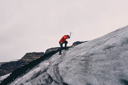 man walking on white mountain thumbnail