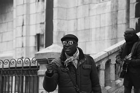 man wearing sunglasses pointing thumbnail