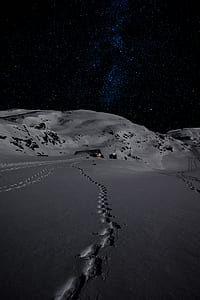 gray desert under black sky with stars at night time thumbnail